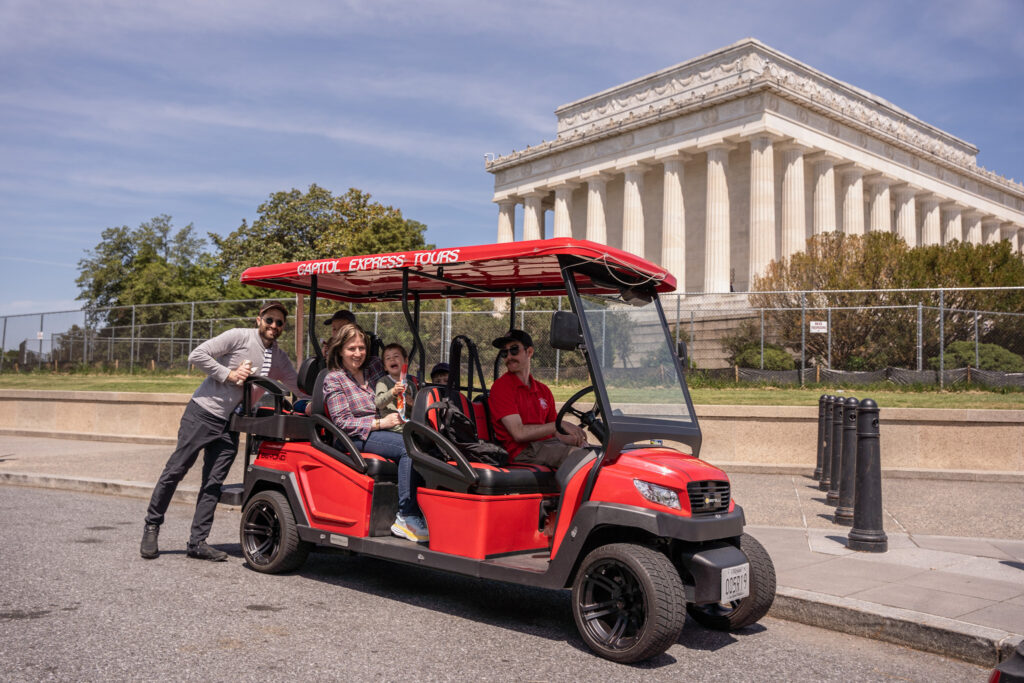 Family in Golf Cart in front of Lincoln Memorial. Photo Taken by Ted Everett