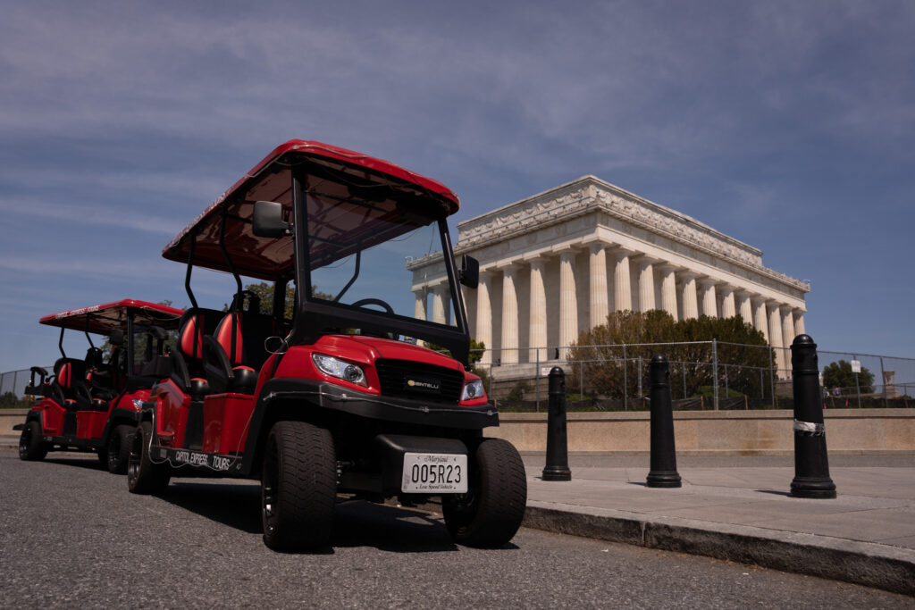 Golf Carts touring in front of Lincoln Memorial. Photo taken by Ted Everett