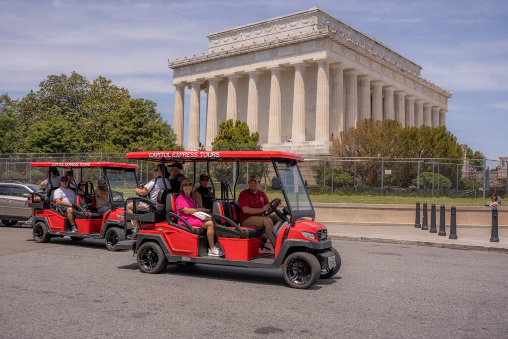 Golf Carts touring in front of Lincoln Memorial. Photo taken by Ted Everett