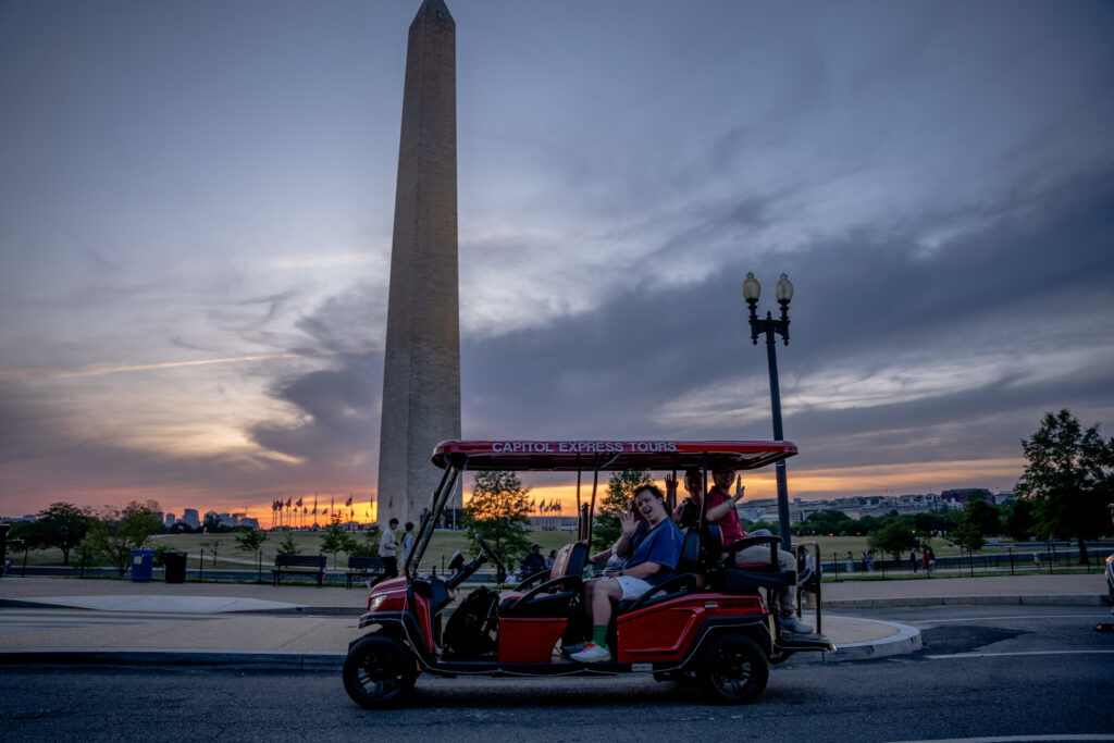 Night tour, Golf Cart touring in front of Washington Monument. Photo taken by Ted Everett
